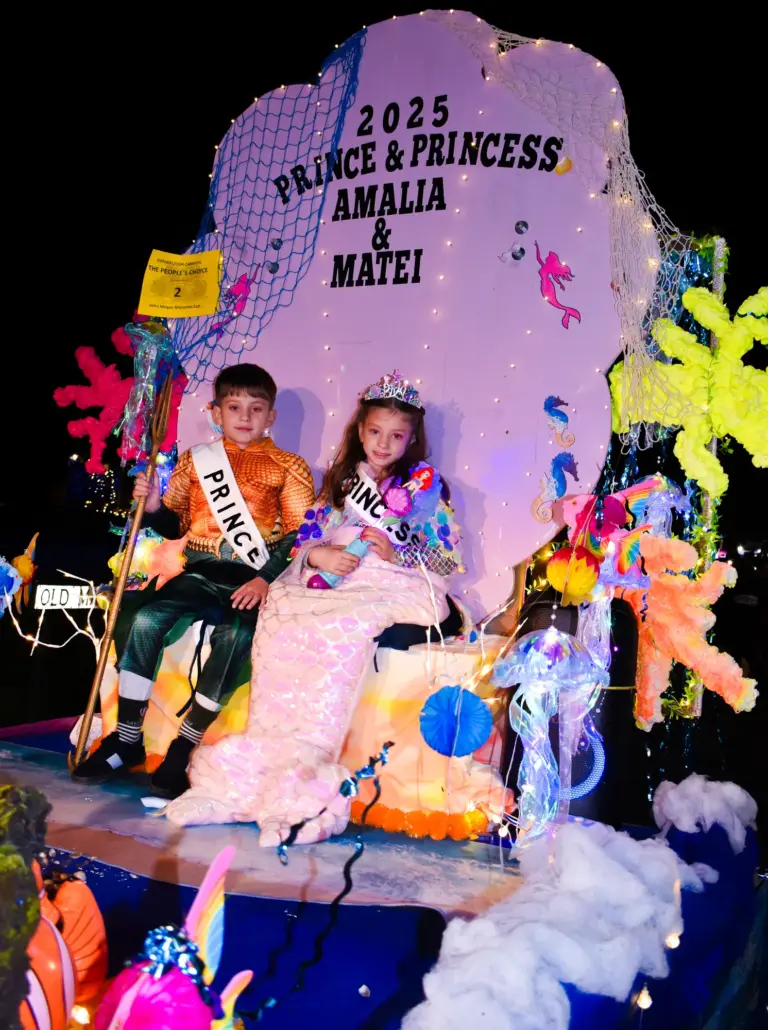 Carnival Prince and Princess 2025 seated on their sparkling under-the-sea themed float