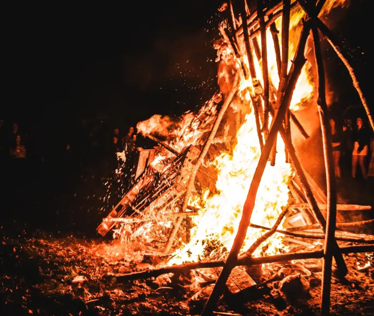 The roaring bonfire throwing up sparks late on Saturday night as the crowd looks on