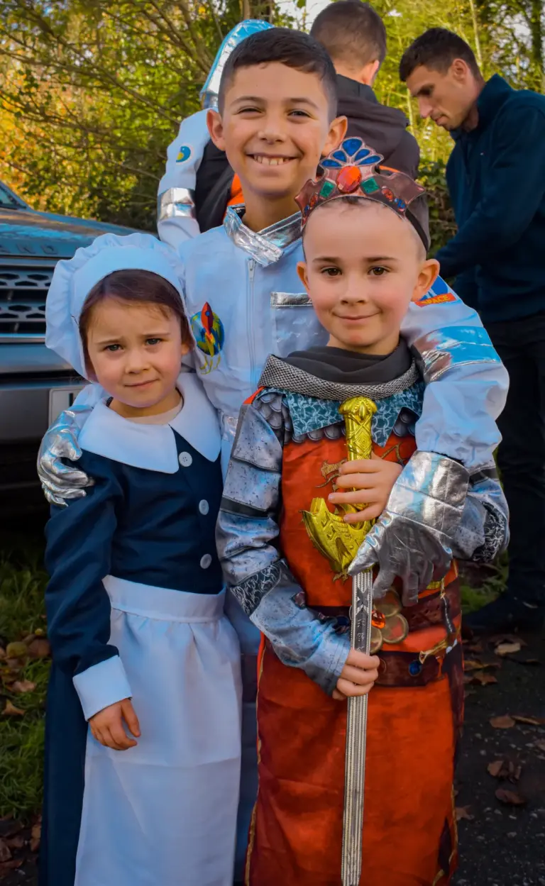 Children dressed as a knight in armour and a Victorian maid at the afternoon parade