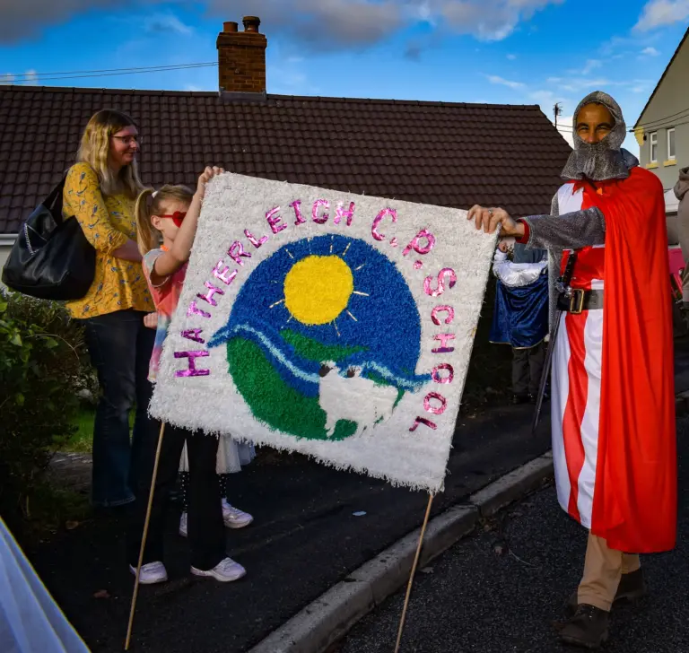 Hatherleigh Community Primary School crepe-paper banner carried in the parade