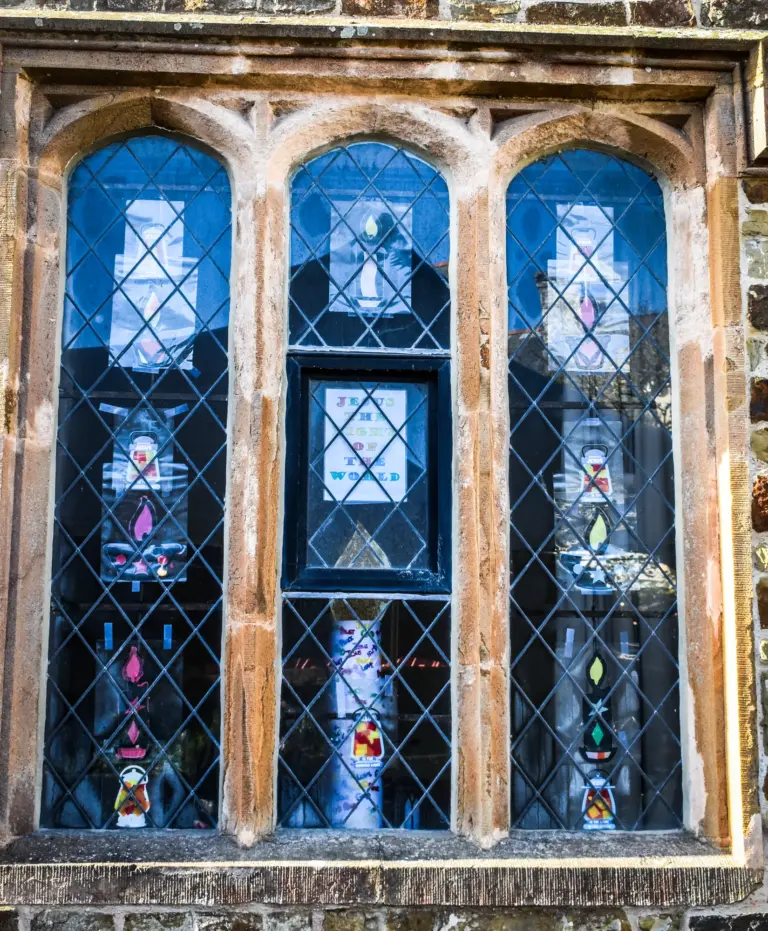 Stone mullioned window with leaded glass and a small display inside