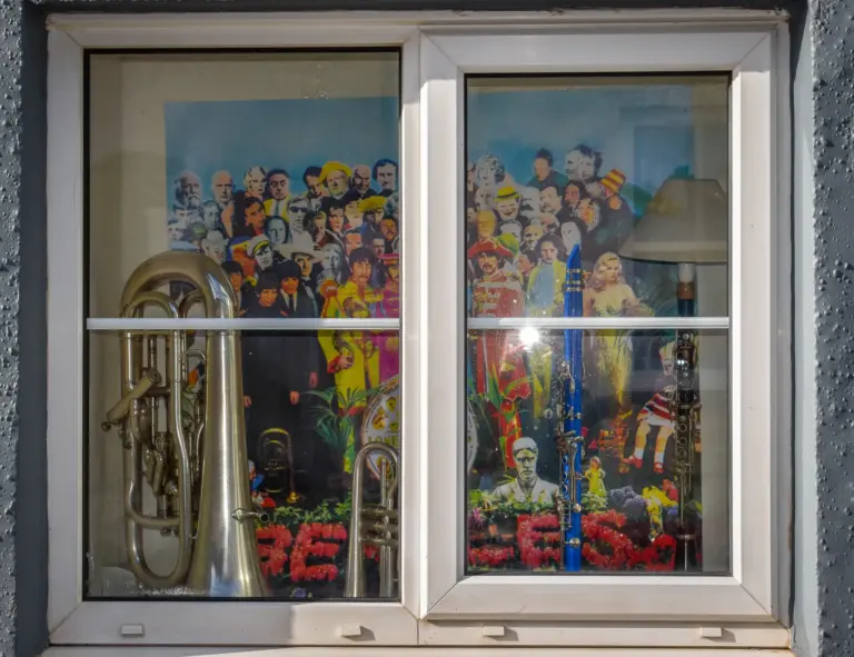 Window display inspired by a famous album cover with a euphonium and painted crowd