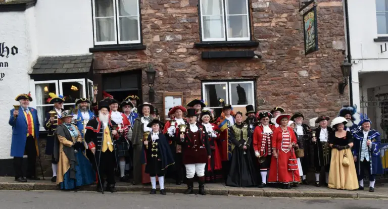 Town criers from across the region in colourful period dress, tricorn hats and bells, gathered outside the inn in Hatherleigh